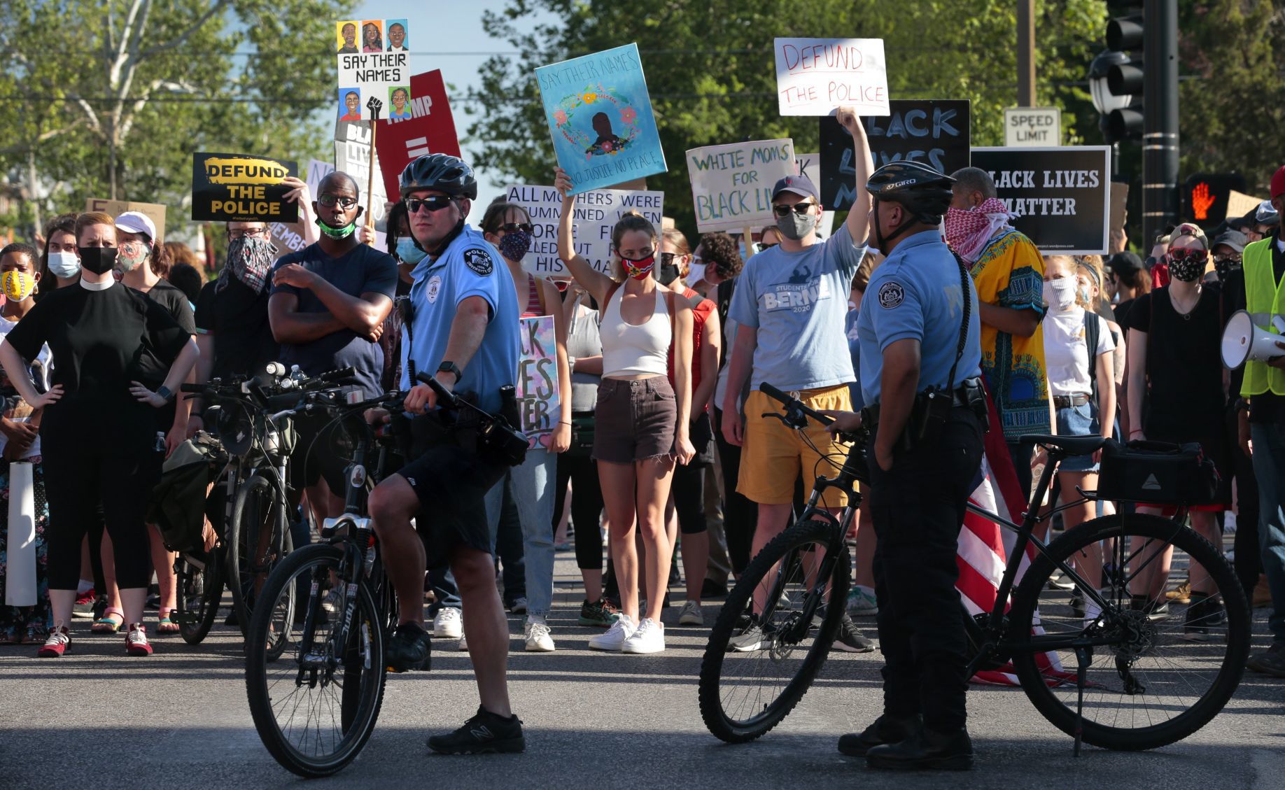 Protesters march through the Delmar Loop